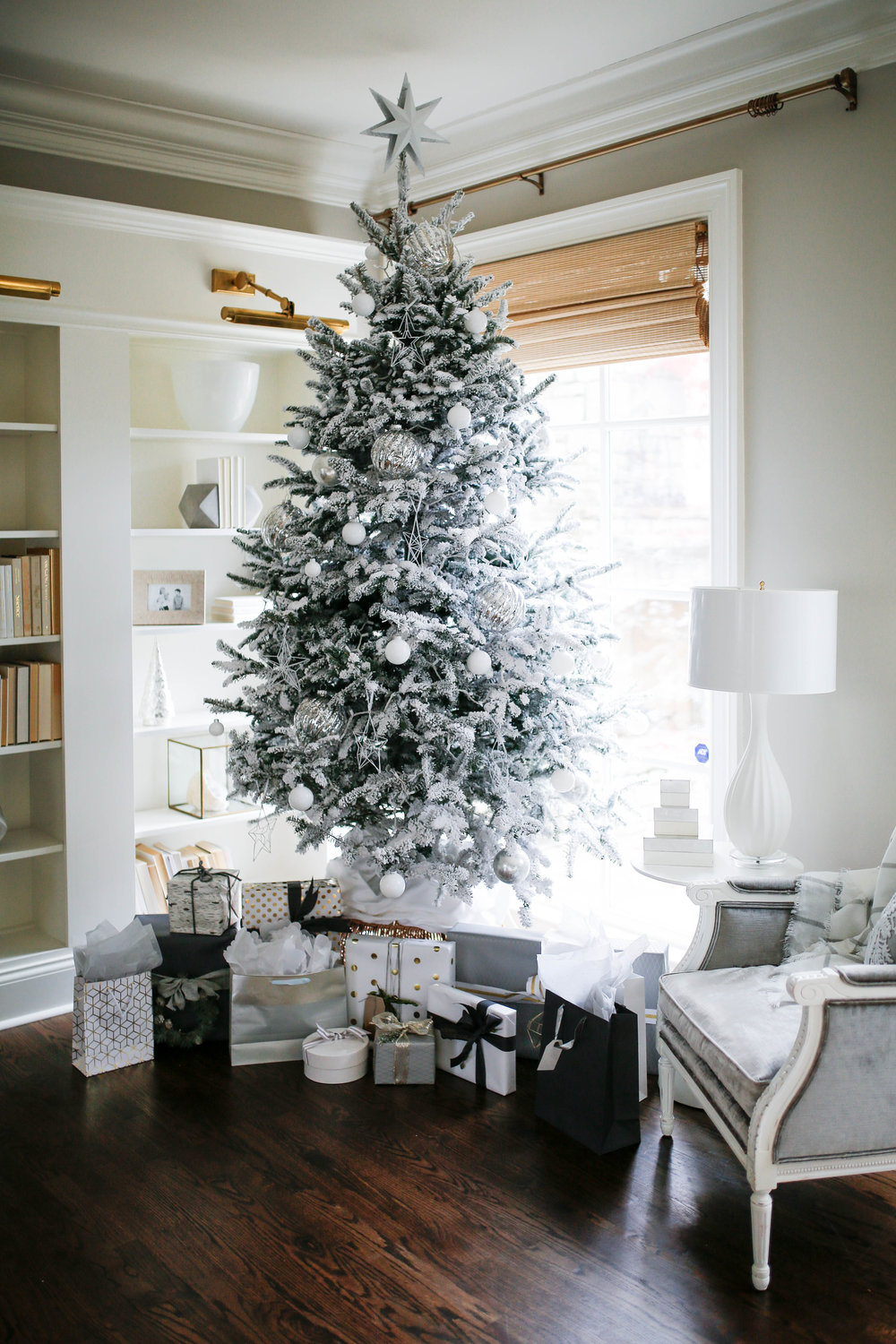  White flocked Christmas tree with white and silver ornaments, a modern christmas tree 